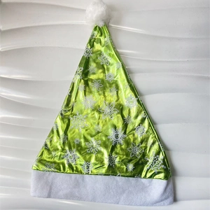 Green metallic Christmas hat with white snowflake print and soft plush pompom decoration