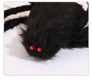 Close-up of a large black furry spider with red bead eyes for Halloween decoration