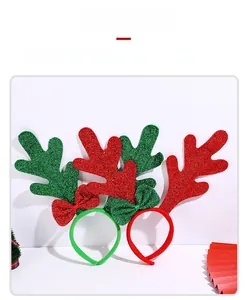Detail of glittery reindeer antlers Christmas headbands with shiny sequin bows decoration