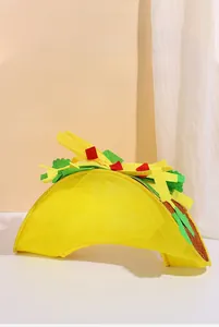 Detailed view of the yellow Taco hat prop with green lettuce and red tomato accents