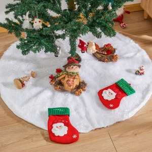 Close-up detail of plush white Christmas tree skirt with soft faux fur texture