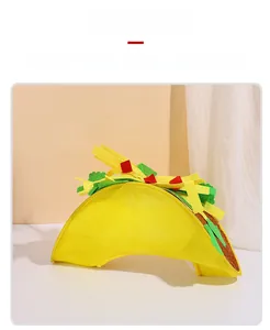 Detailed close-up of a taco-shaped felt pet bed with colorful vegetable simulation textures