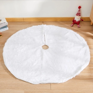 Detailed close-up of fluffy white faux fur Christmas tree skirt on light wooden floor