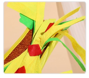Macro shot of durable plush taco toy with colorful felt layers and soft fleece texture