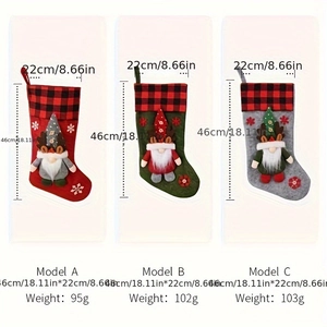 Detailed view showing three festive 46cm Christmas stockings with gnome 3D appliques
