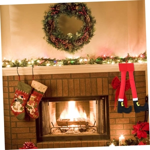 Décoration de Noël jambes d'elfe avec leggings rouges et bottes noires à boucles