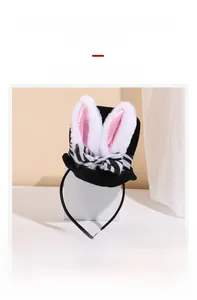 Detail view of plush bunny ear headband with velvet fabric and zebra print bow accessory