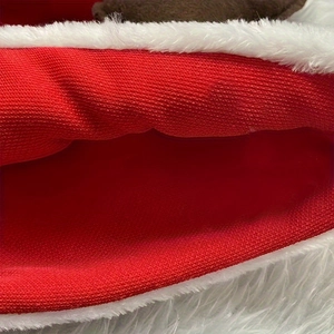 Classic red Christmas hat with white plush trim and decorative reindeer antlers and leaves