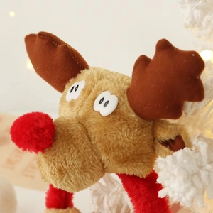Close-up of plush reindeer headband with soft fur texture and a cute red pom-pom nose