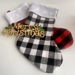 Classic red and black plaid Christmas stockings with white faux fur trim set of two