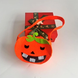 Cute Halloween pumpkin trick or treat candy bag made of felt with 3D face design