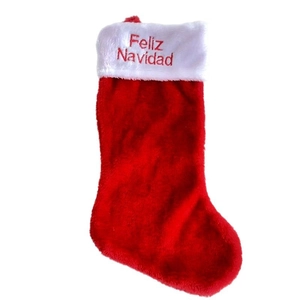 Red plush Christmas stocking with white trim and Feliz Navidad embroidery decor