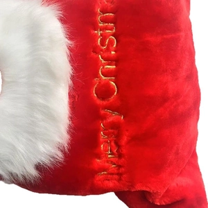 Red plush Christmas gift bag with white faux fur trim and gold Merry Christmas embroidery