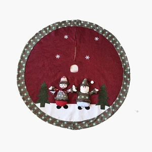 Red Christmas tree skirt with snowman embroidery and green snowflake patterned border
