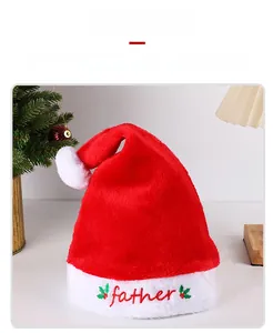 Macro detail of plush Christmas hat with embroidered Father text and holly leaf decor
