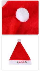 Detail of soft plush Christmas hat with red father embroidery and white pompom