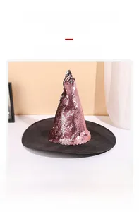 Detail view of pink sequin witch hat showing the shimmering texture and wide black brim