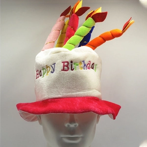 Close-up of plush birthday cake hat with colorful candles and Happy Birthday embroidery
