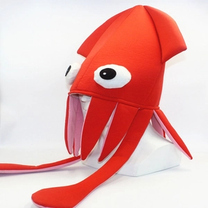Macro detail of vibrant red plush octopus hat with oversized 3D eyes and long tentacles