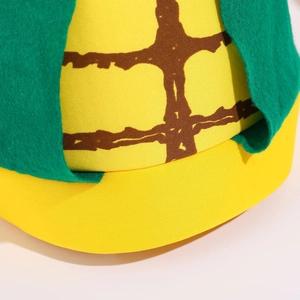 Chapeau de maïs rigolo pour fête avec motif jaune texturé et feuilles en feutrine