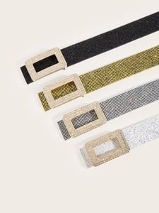 Detail showing four sparkling sequined belts in black, gold, silver and white colors