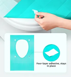 Detail of disposable toilet seat cover with four-point adhesion for secure positioning