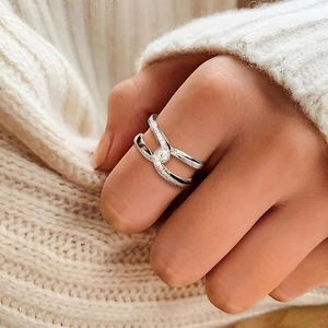 Elegant S925 sterling silver crisscross ring with pavé diamonds on a hand