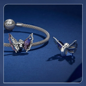 Macro view of S925 silver skull butterfly charm with purple crystal and Forever Family clasp
