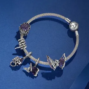 Gothic sterling silver snake chain bracelet with purple gems and skull charms