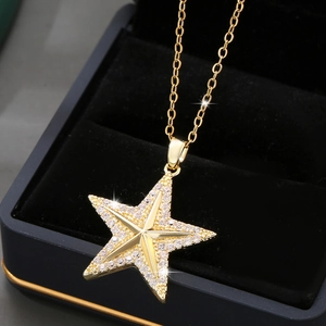 Sparkling 14K gold plated star pendant necklace with cubic zirconia on black velvet