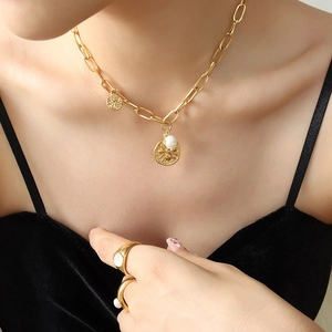Vintage gold chunky chain necklace with embossed coin pendants and baroque pearl detail