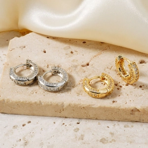 Micro-paved zircon hoop earrings in gold and silver finish with high-shine cubic zirconia