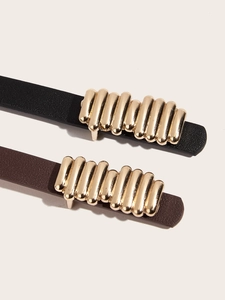 Detail view of premium PU leather belts with polished gold metallic tube buckles