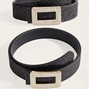 Detail of black sequined belts with shimmering crystal-embosssed rectangular buckles