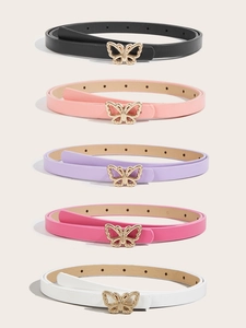 Detail of five colorful skinny belts for girls with shiny golden butterfly buckles