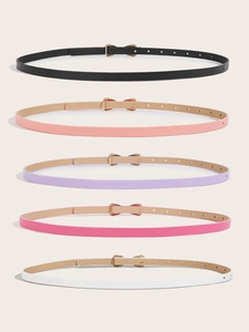 Detail of five colorful girls' bow belts in black, pink, lavender, white and beige