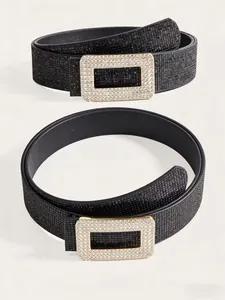 Close-up of black sequined fashion belt with a rectangular rhinestone-encrusted buckle
