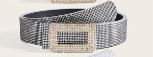 Macro shot of luxury silver belt with sparkling rhinestones and crystal buckle