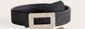 Detail of black rhinestone belt with gold buckle and sparkling crystals for women
