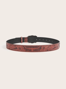 Detail of embossed bull head and floral patterns on vintage brown PU leather belt