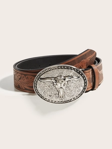 Detail of western PU leather belt with floral embossing and large silver bull head buckle