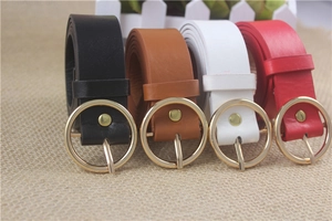 Detail showing four colors of faux leather belts with polished gold round buckles