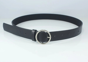Detail of a thin black leather belt featuring a round silver metal buckle and adjustment holes