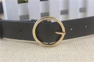 Classic black leather belt for women featuring a polished gold round metal buckle closure