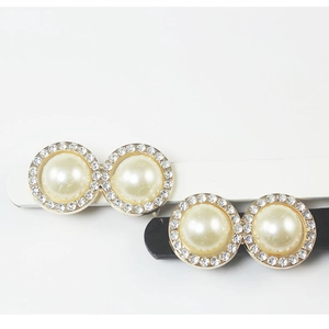 Elegant pearl and rhinestone hair clip set with sparkling crystals and gold-plated base