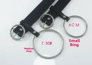 Detail showing 6cm and 7.5cm silver circular metal buckles on black leather belts