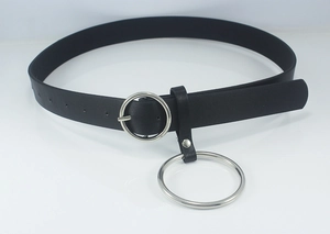 Detail of a black leather belt with a decorative silver metal ring and circular buckle