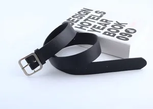 Detailed view of black leather belt featuring a classic silver square metal buckle closure