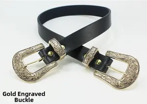 Detailed close-up of double vintage gold engraved buckles on a black leather belt