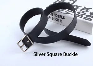 Close-up of black leather belt with a silver square buckle and elegant matte texture